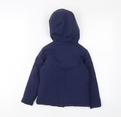 Back view of Castore boys’ blue basic coat coat, size 4-5, years zip - zip pockets