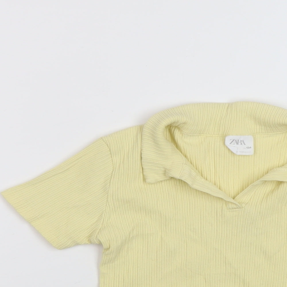 Close-up detail of Zara girls’ yellow polyester basic polo, size 9, years collared pullover
