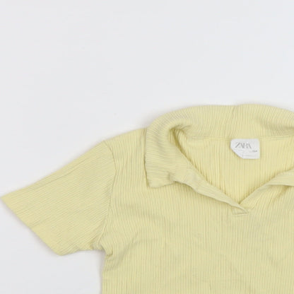 Close-up detail of Zara girls’ yellow polyester basic polo, size 9, years collared pullover