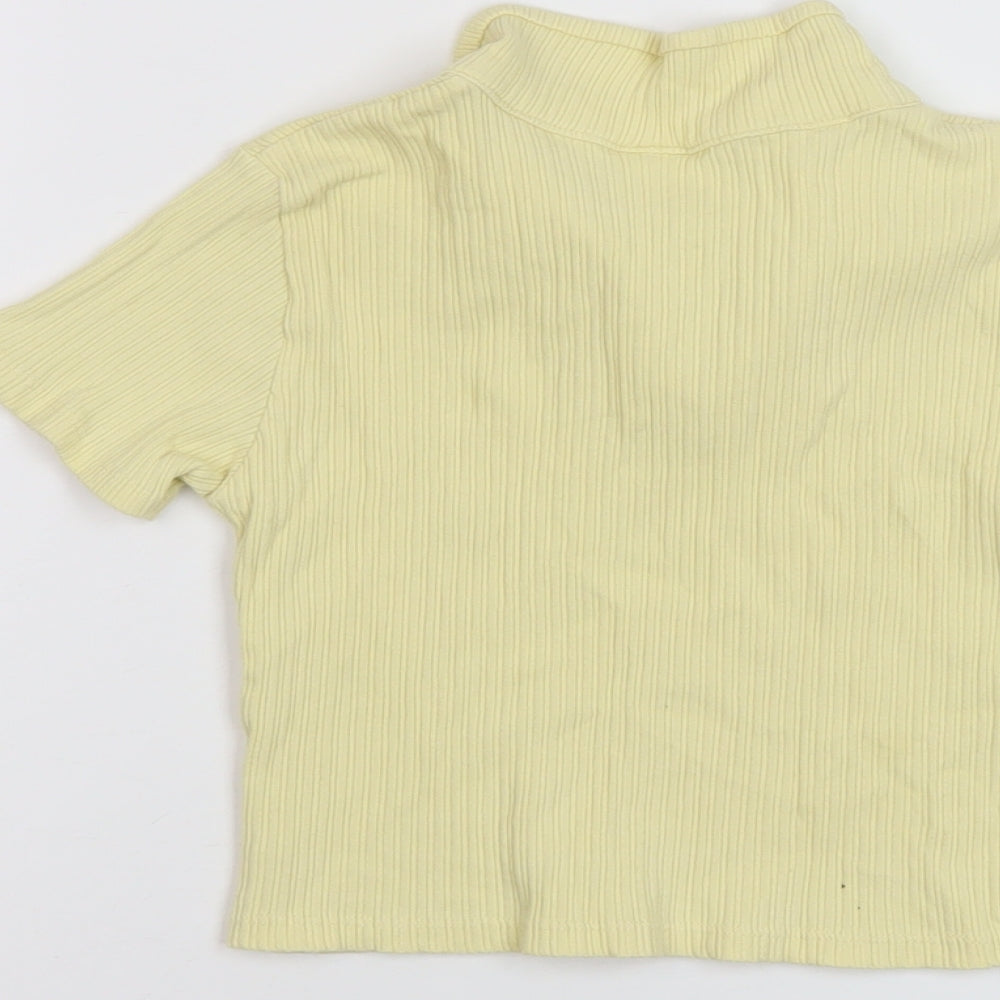 Brand and care label for Zara girls’ yellow polyester basic polo, size 9, years collared pullover