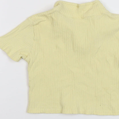 Brand and care label for Zara girls’ yellow polyester basic polo, size 9, years collared pullover