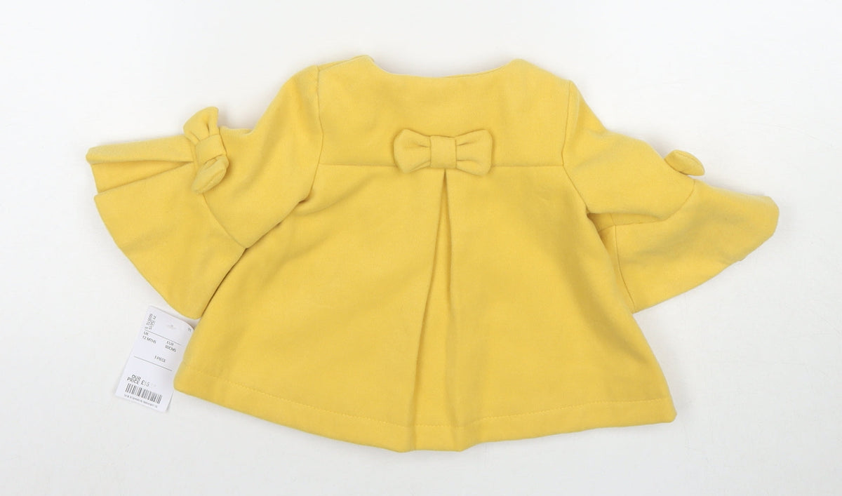Back view of Maxx girls’ yellow pea coat coat, size 12, months button