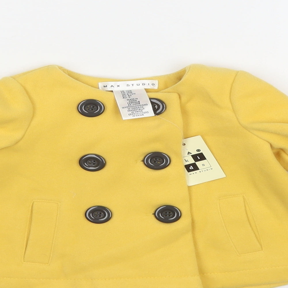 Close-up detail of Maxx girls’ yellow pea coat coat, size 12, months button