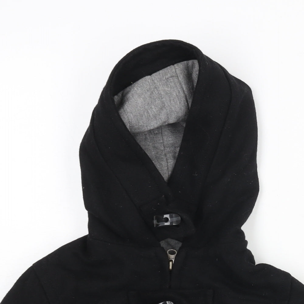 Close-up detail of Zara boys’ black bomber jacket jacket, size 4-5, years zip - toggle hooded