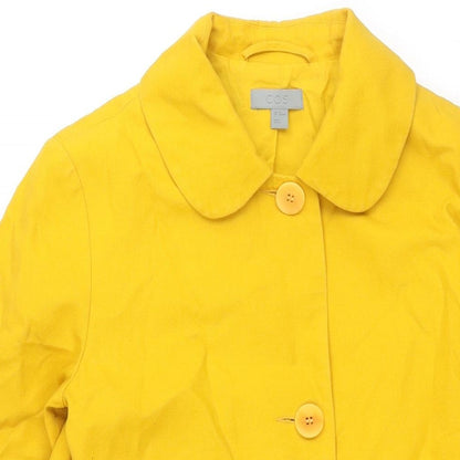 Close-up detail of COS women’s yellow jacket, size UK 8, button
