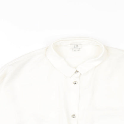 Close-up detail of River Island girls’ white polyester basic button-up, size 11-12, years collared button