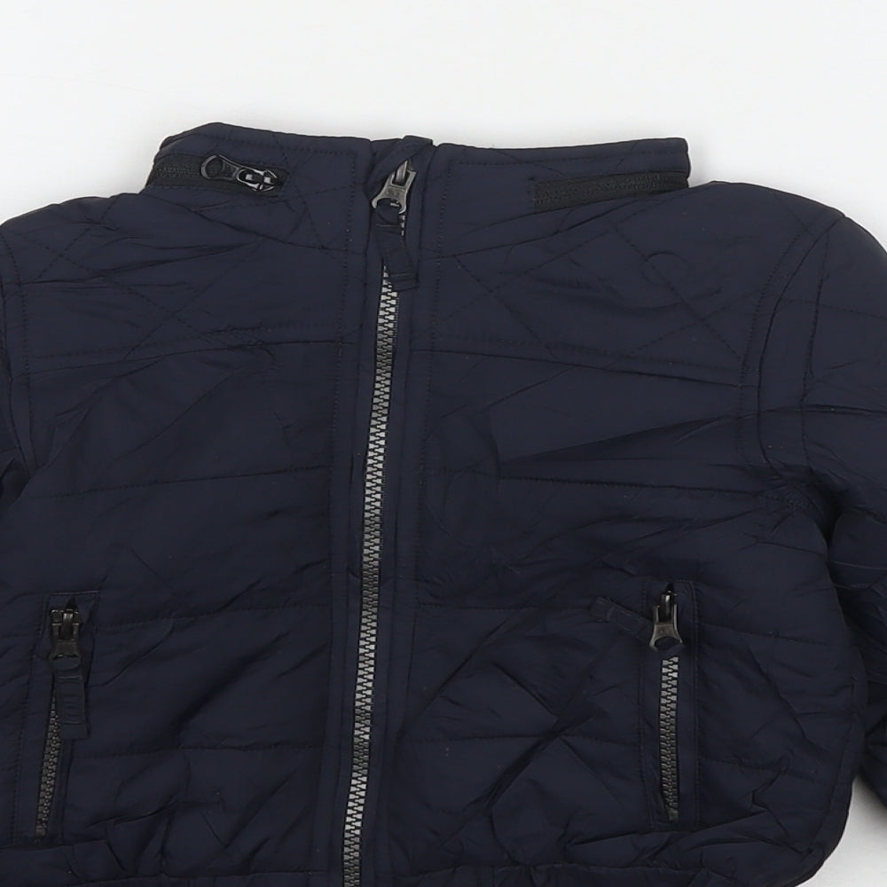 Close-up detail of Marks & Spencer boys’ blue jacket, size 2-3, years zip