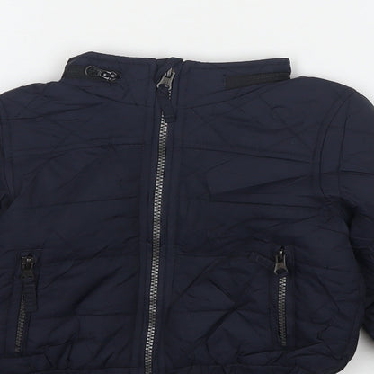 Close-up detail of Marks & Spencer boys’ blue jacket, size 2-3, years zip