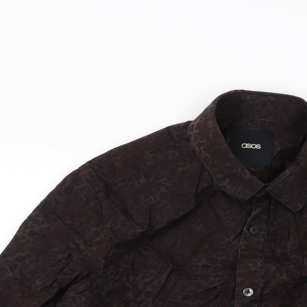 Close-up detail of ASOS men’s brown animal print cotton button-up, size M, collared button