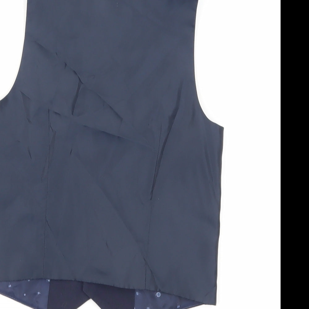 Brand and care label for Next boys’ blue jacket waistcoat, size 5, years button