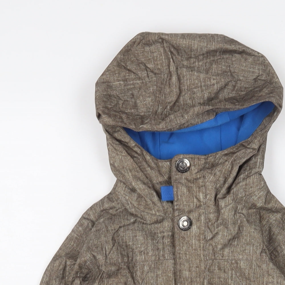Close-up detail of Decathlon boys’ green jacket coat, size 8, years zip