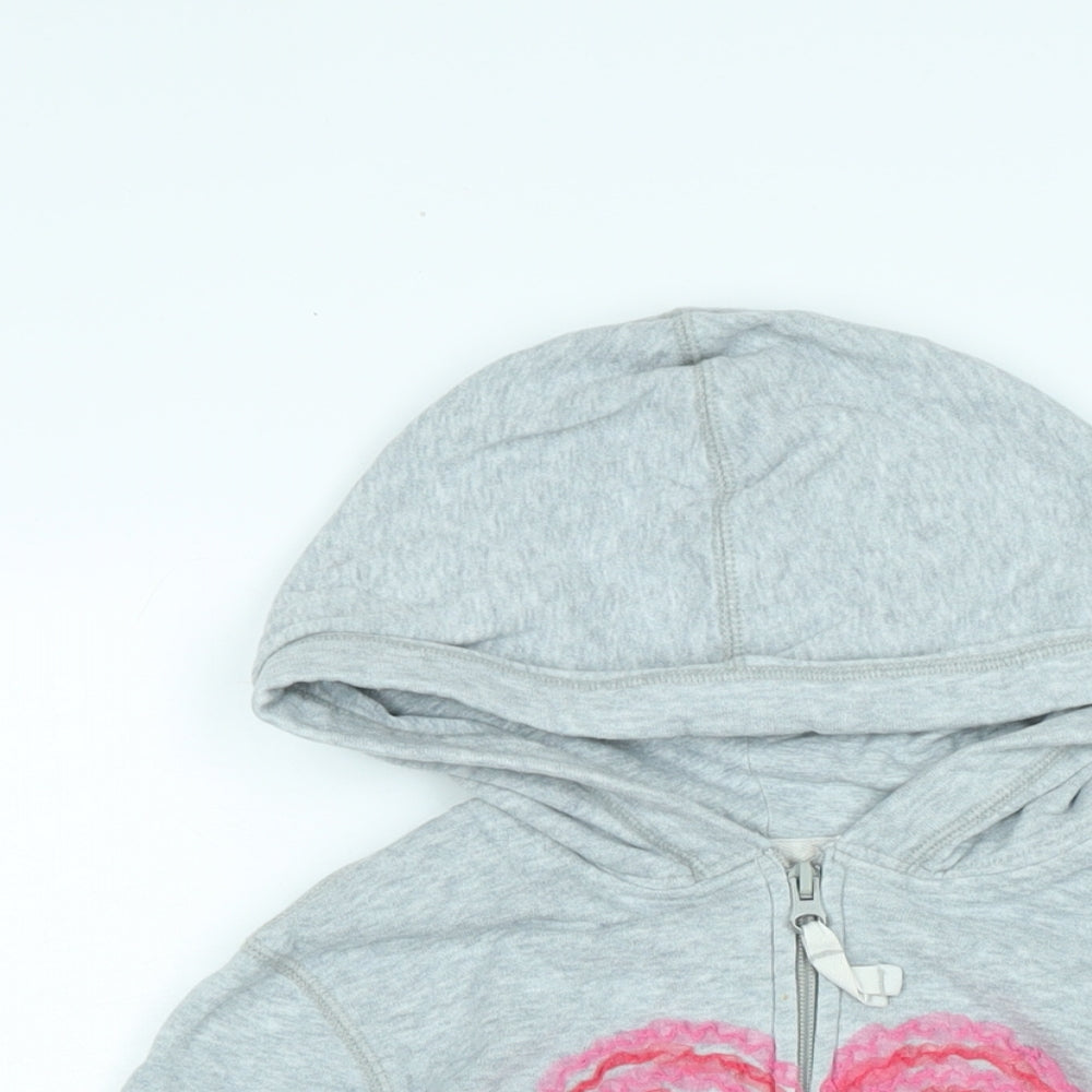 Close-up detail of Gap girls’ green jacket, size M, zip - logo