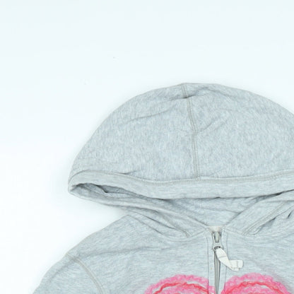 Close-up detail of Gap girls’ green jacket, size M, zip - logo