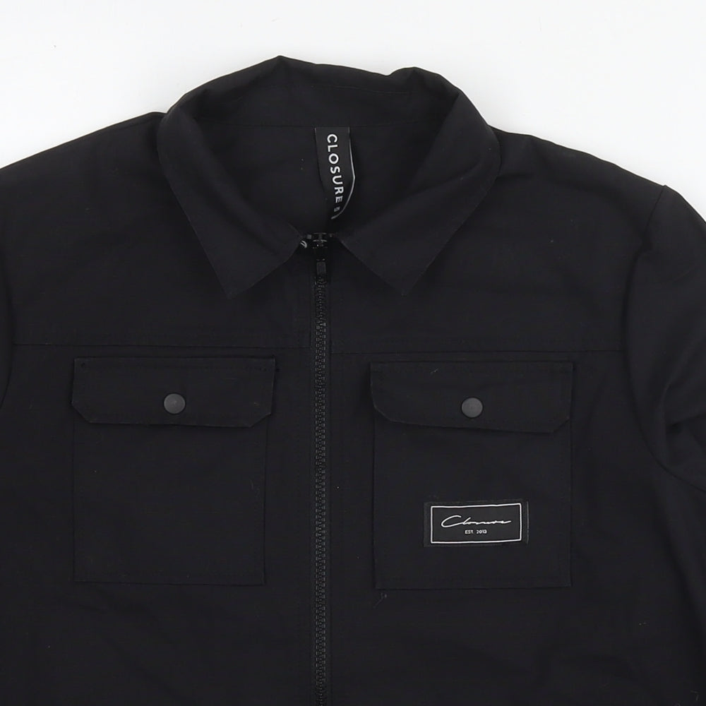 Close-up detail of Closure boys’ black jacket, size 12-13, years zip