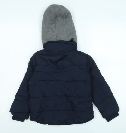 Back view of Next boys’ blue quilted coat, size 5, years zip