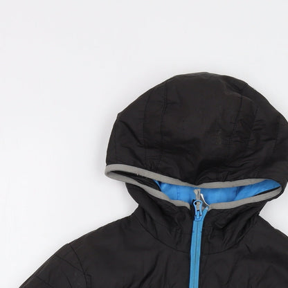 Close-up detail of Quechua boys’ black puffer jacket jacket, size 10, years zip