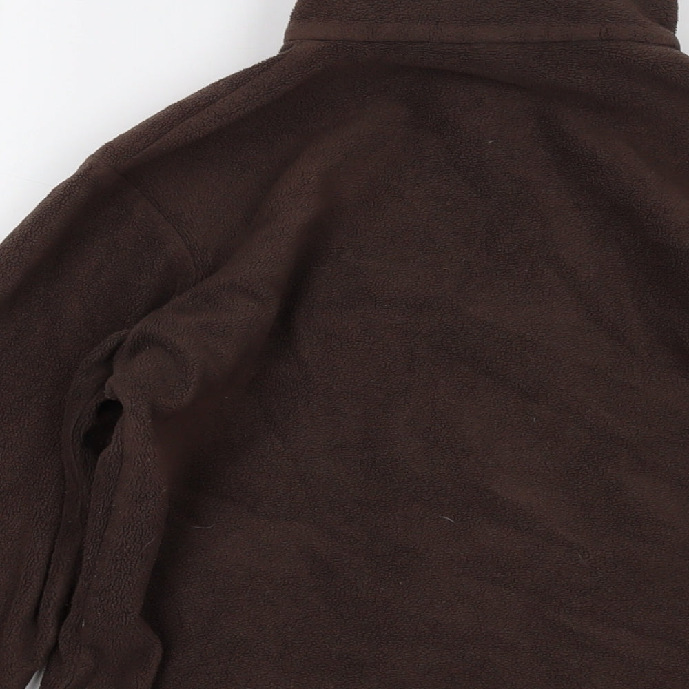 Brand and care label for Quechua boys’ brown jacket, size 12, years zip