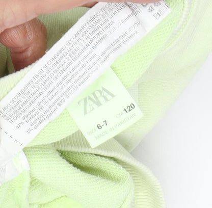 Close-up detail of Zara boys’ green pullover sweatshirt, size 6-7, years