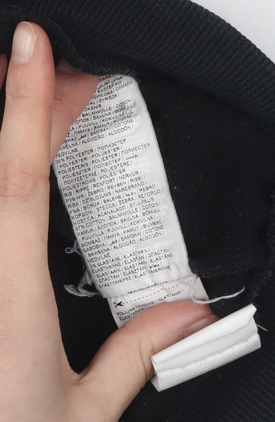 Close-up detail of Puma boys’ black graphic pullover sweatshirt 13-14 years