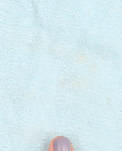 Close-up detail of DKNY girls’ blue basic t-shirt, size S, logo accent