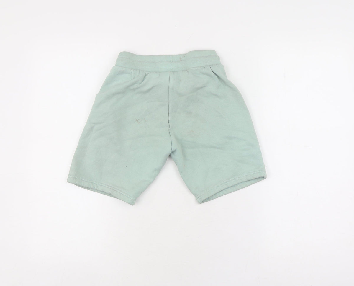 Back view of Adidas boys’ green sweat shorts, size 9-10, drawstring pockets
