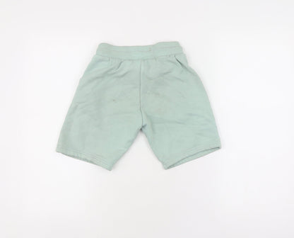 Back view of Adidas boys’ green sweat shorts, size 9-10, drawstring pockets