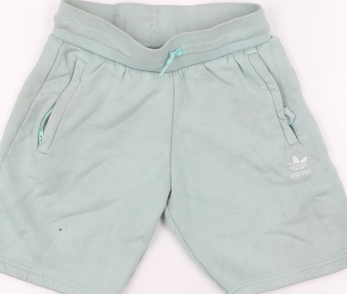 Close-up detail of Adidas boys’ green sweat shorts, size 9-10, drawstring pockets