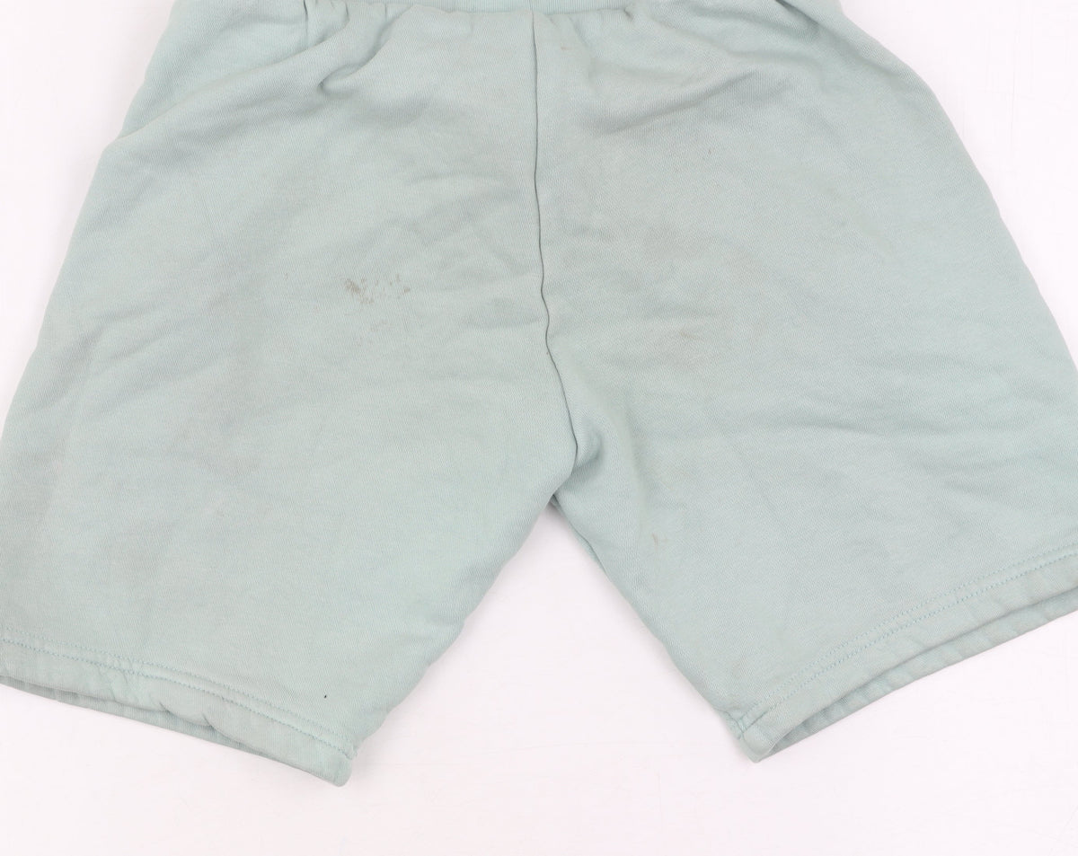 Brand and care label for Adidas boys’ green sweat shorts, size 9-10, drawstring pockets
