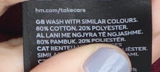 Close-up detail of H&M girls’ red pullover sweatshirt, 8 years, ruffle accent