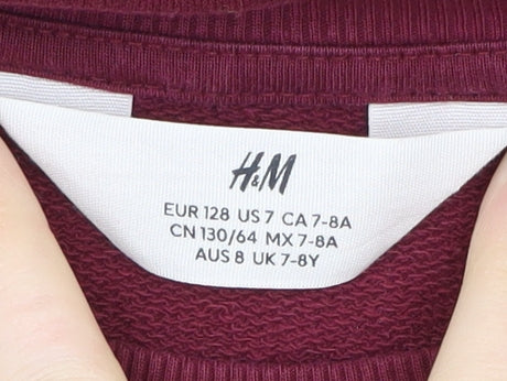 Brand and care label for H&M girls’ red pullover sweatshirt, 8 years, ruffle accent