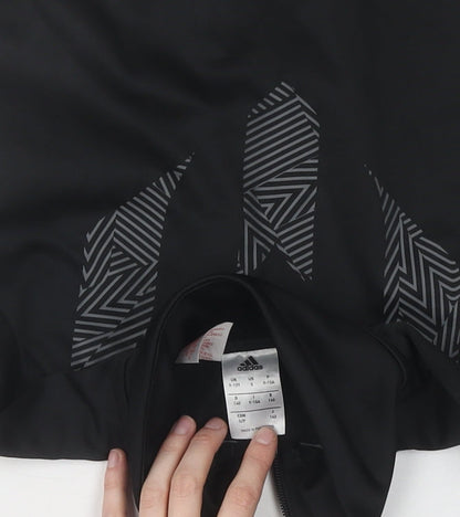 Brand and care label for adidas boys’ black track jacket, size 13, athletic fit