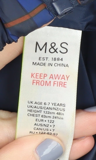 Close-up detail of Marks & Spencer boys’ blue puffer jacket 6-7 years