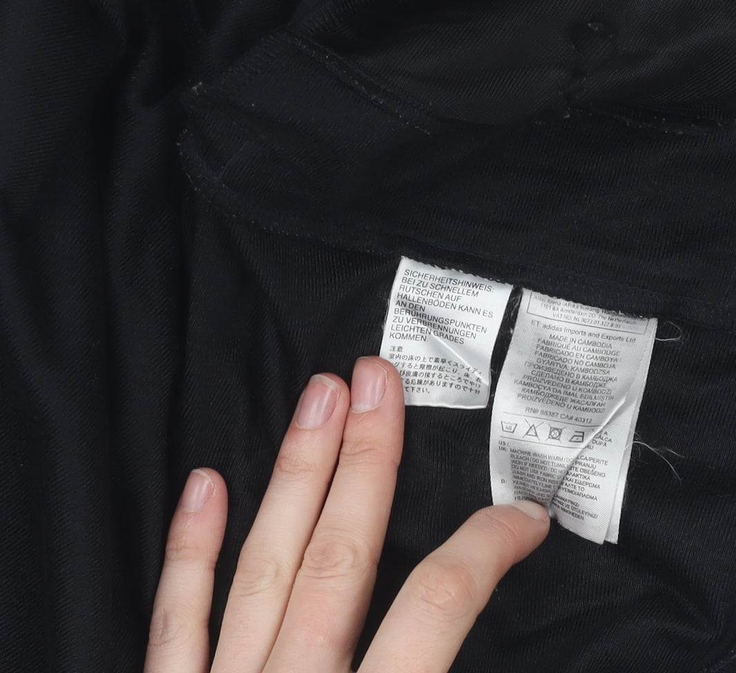 Close-up detail of Adidas boys’ black track jacket 7-8 years