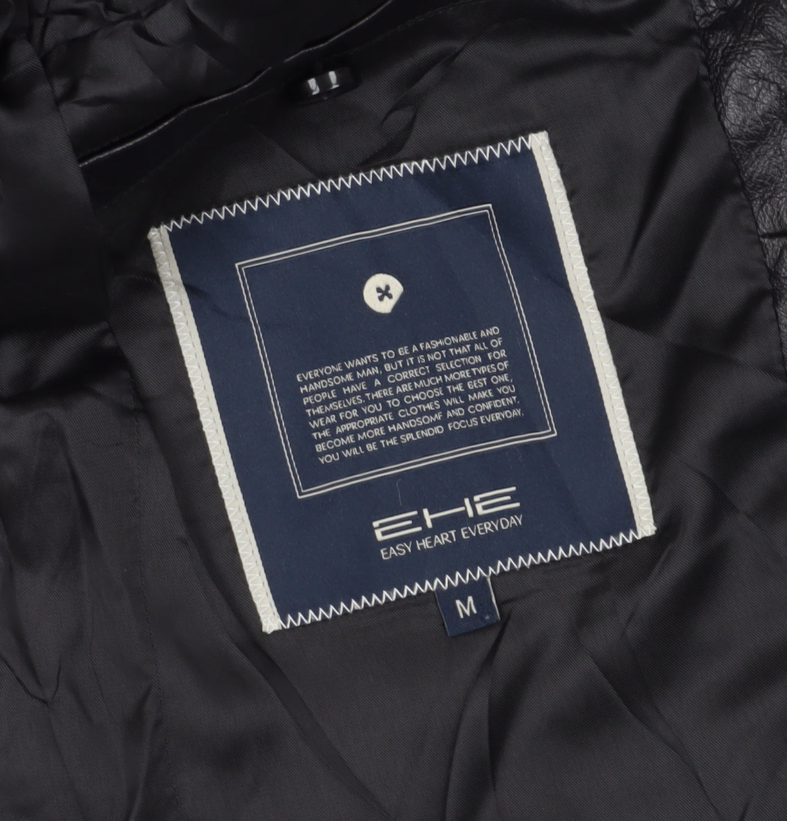 Close-up detail of EHE boys’ black jacket m, autumn winter lined full zip