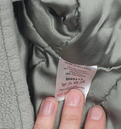 Close-up detail of Next girls’ green hooded polyester jacket - 12 years