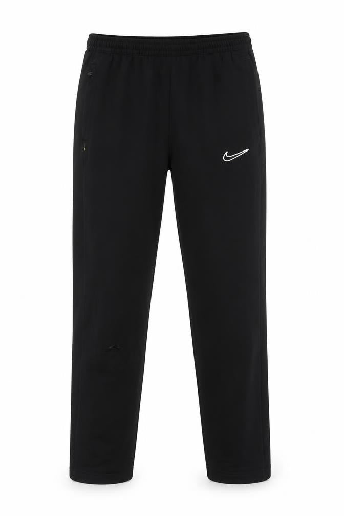 Front view of Nike boys’ black jogger trousers xl for running