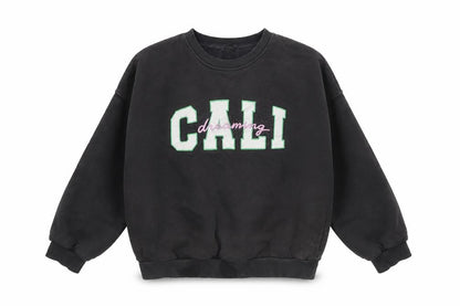 Front view of Marks & Spencer girls’ black pullover sweatshirt 9-10y