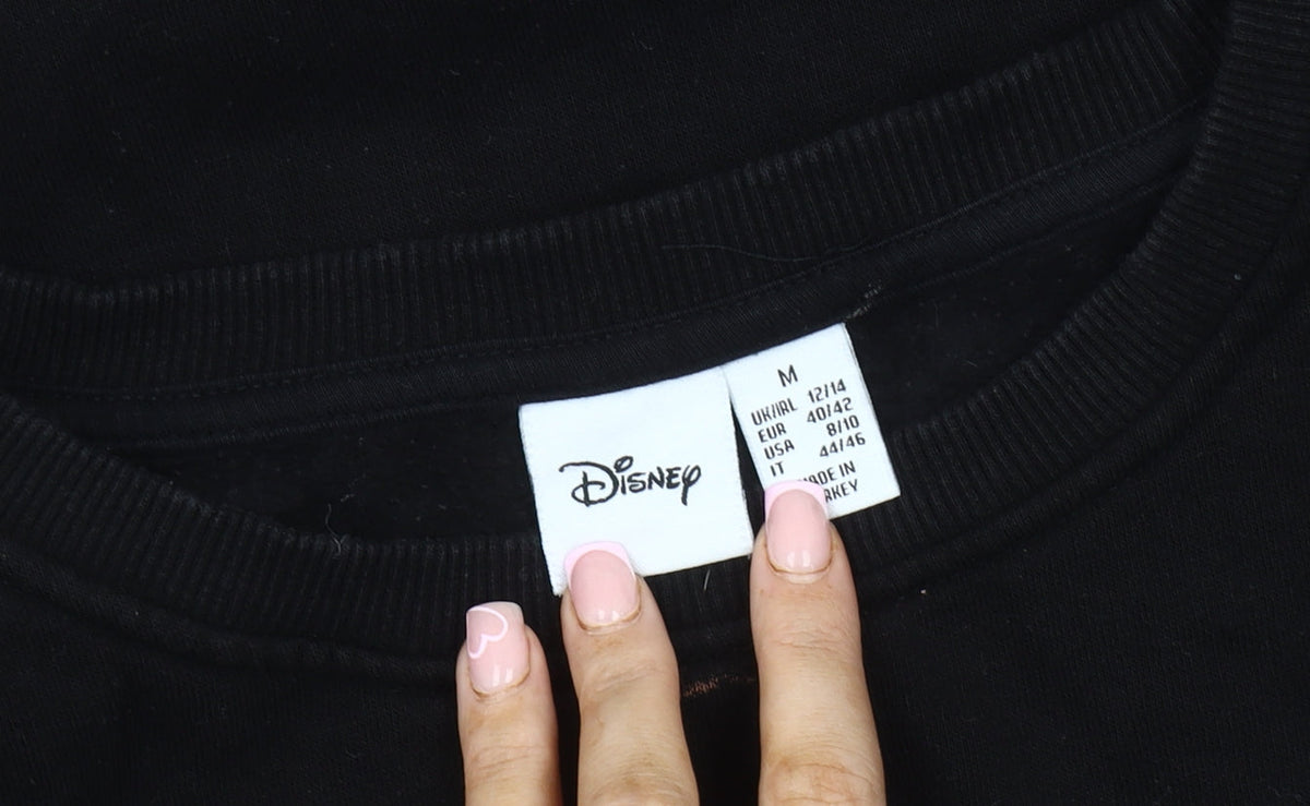 Close-up detail of Disney unisex black pullover sweatshirt m