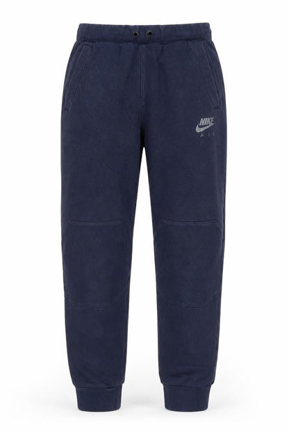 Front view of Nike boys’ blue jogger trousers xl
