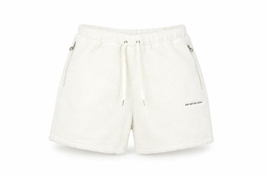 Front view of MKI MIYUKI ZOKU unisex white acrylic shorts l