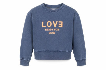 Front view of Zara girls’ blue love paris graphic pullover sweatshirt 11-12 years