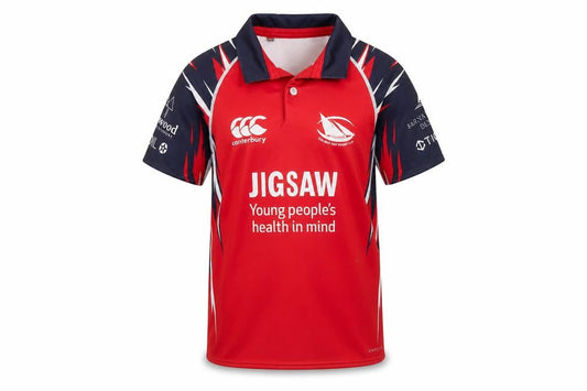 Front view of Canterbury boys’ red rugby polo shirt 8 years jigsaw design