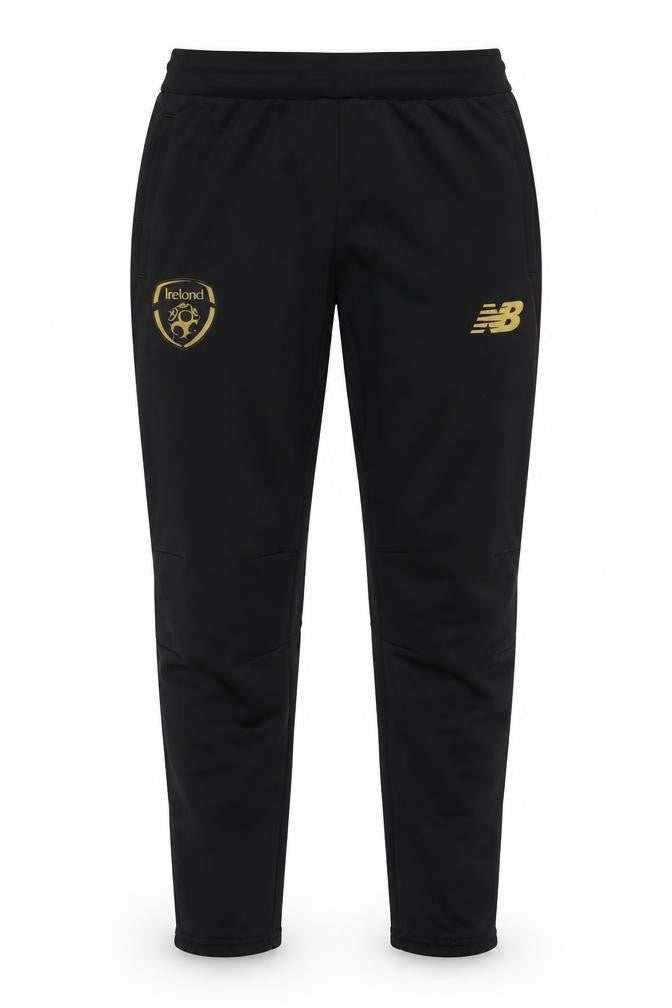 Front view of New Balance boys’ black xl track pants football training tapered fit
