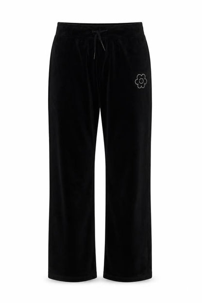 Front view of Dunnes girls’ black velour sweatpants 25in waist - flower detail
