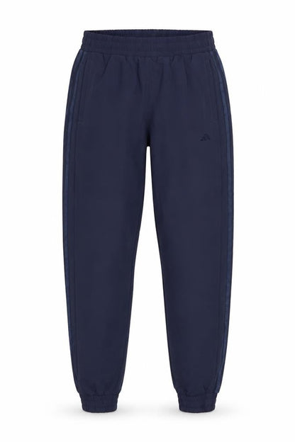 Front view of Adidas women’s navy blue jogger activewear trousers, size UK 12, polyester blend