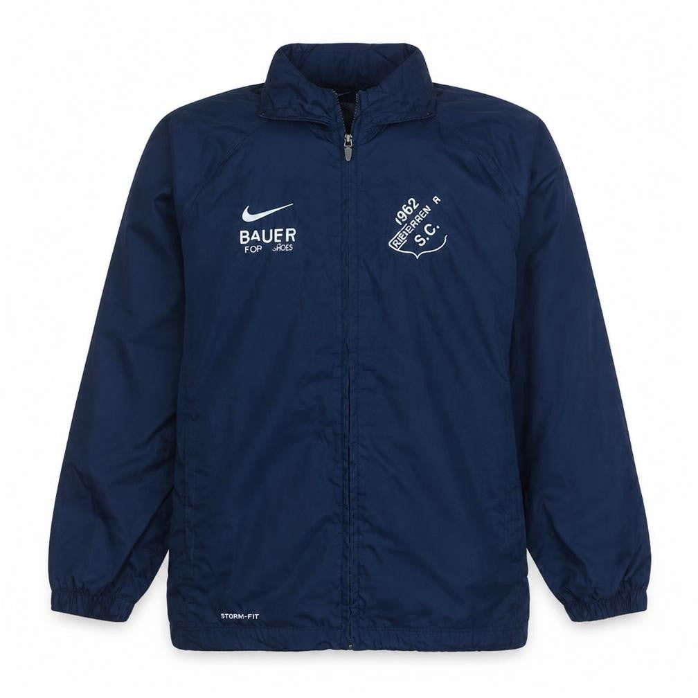 Front view of Nike boys’ blue football track jacket 12-13 years lined waterproof windproof