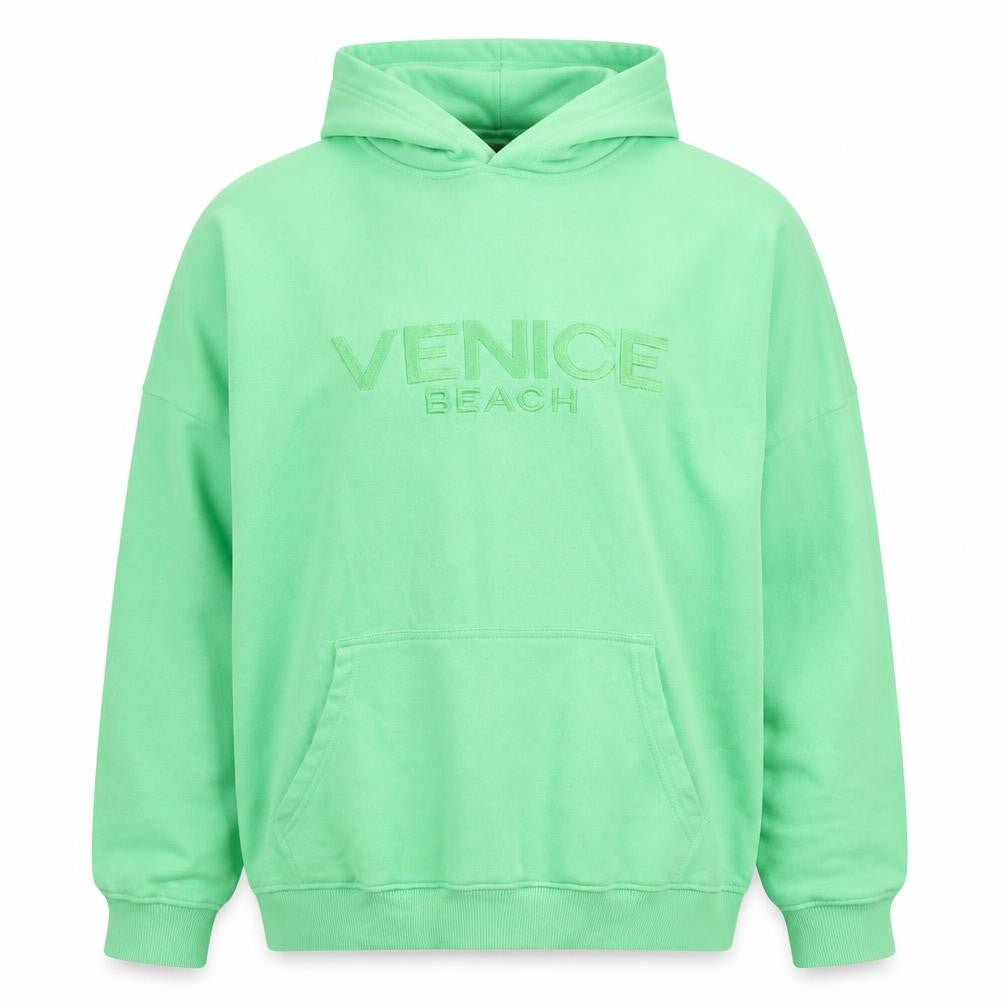 Front view of PRETTYLITTLETHING unisex green pullover hoodie l relaxed fit embroidered
