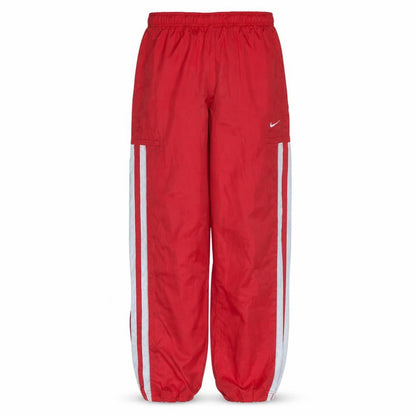 Front view of Nike boys’ red track pants 10 years elastic waist side stripe activewear