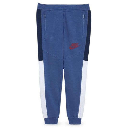 Front view of Nike boys’ blue colourblock jogger trousers s elastic waist zip pockets