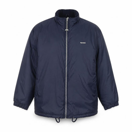 Front view of Reebok Essentials Blue boys’ puffer jacket full zip lined